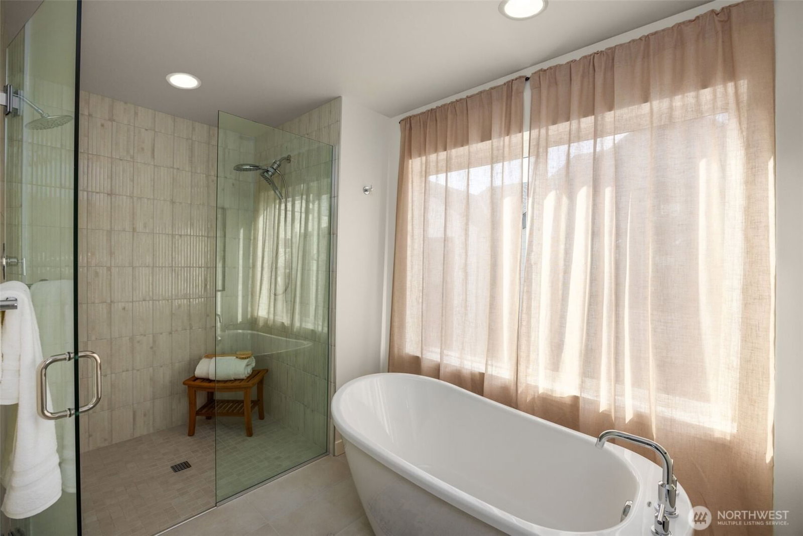 Primary bath with a walk-in shower and soaking tub