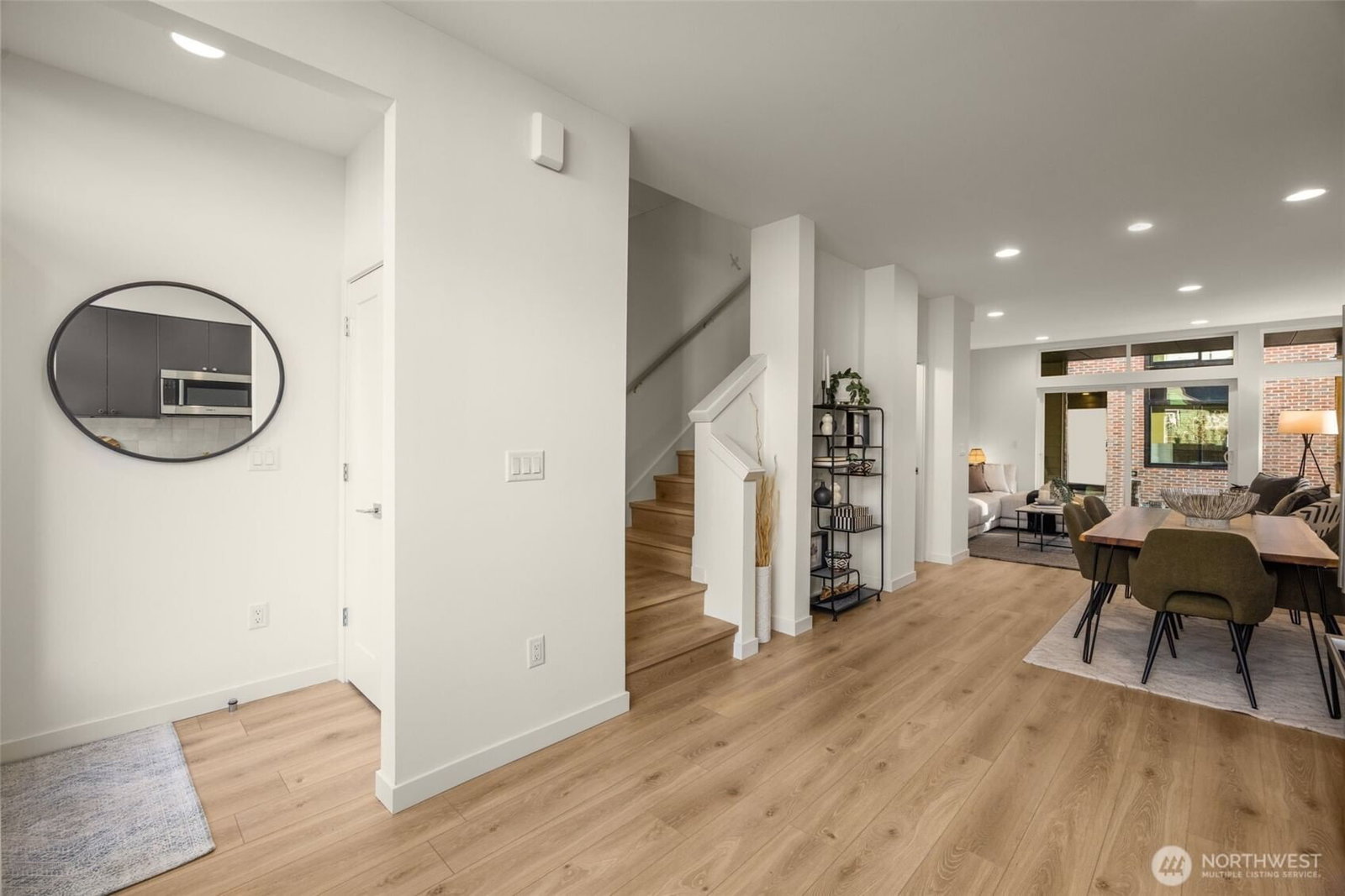 The entry hall from the courtyard, stair to the living floor