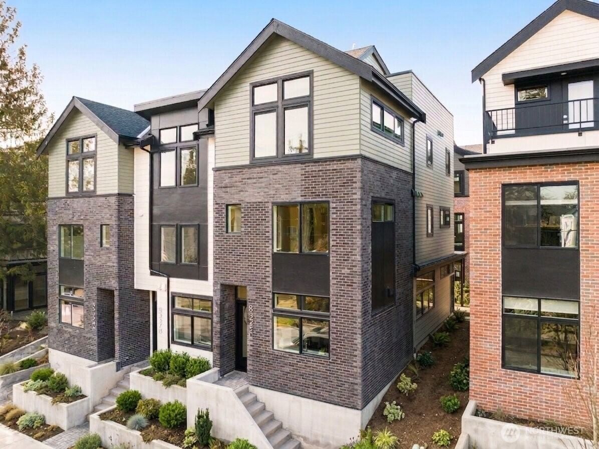 Willow 12th from 12th Ave NW: four-level townhomes in brick and dark siding behind their entry courtyards